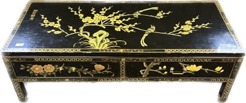 Oriental lacquered coffee table with two drawers raised on square legs [40x122x51cm]