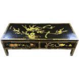 Oriental lacquered coffee table with two drawers raised on square legs [40x122x51cm]