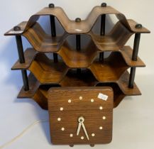 Mid century 8 section wine rack together with a mid century desk clock