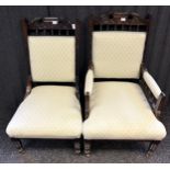 19th Century oak His and Her chairs, the whole cushioned in a neutral upholstery raised on turned