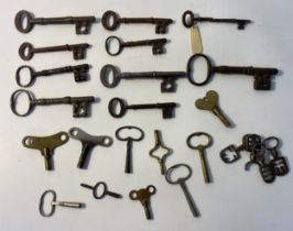 A collection of antique keys; old door keys, safe keys and clock keys