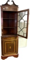 Edwardian corner display cabinet with marquetery frieze above an astragal glazed door, surmounted by