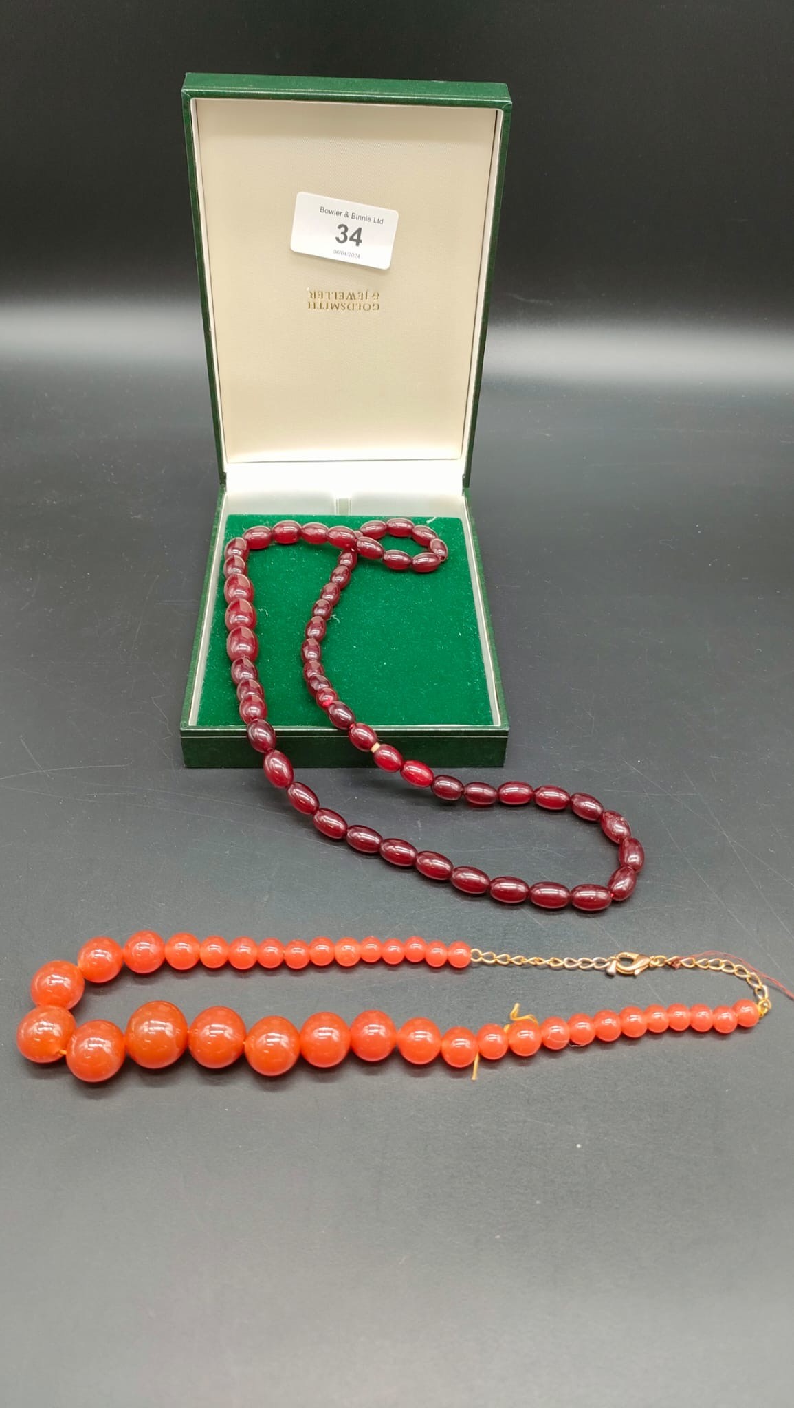 Vintage cherry amber graduating bread necklace. Together with a vintage orange glass bead