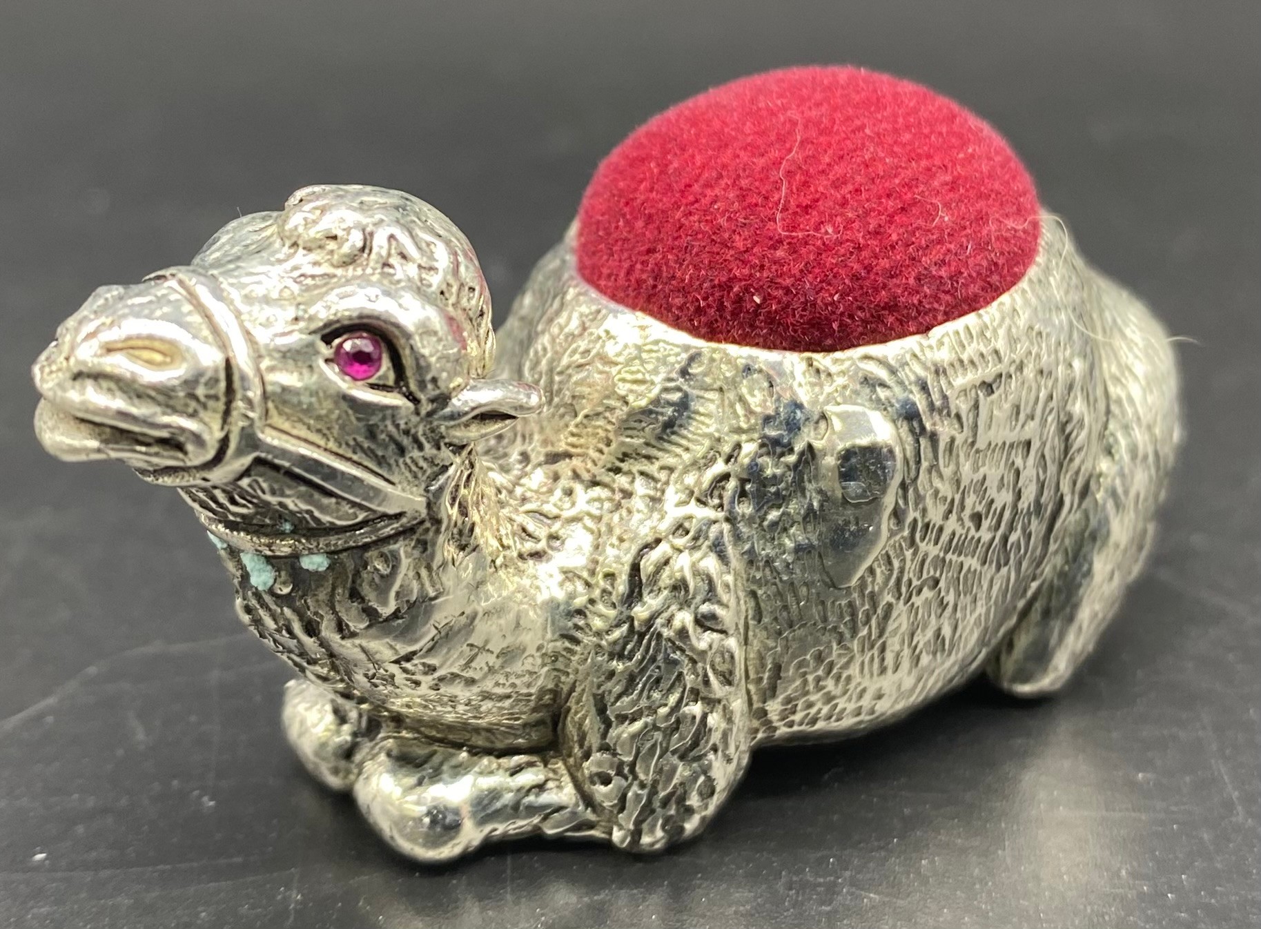 Heavy silver plated camel pin cushion set with Ruby eyes