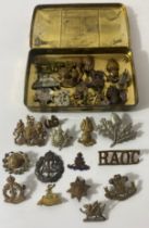 Tin of military badges mostly WW1 and WW2