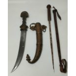 An eastern ceremonial dagger with brass fitted scabbard along with an antique horse crop with secret