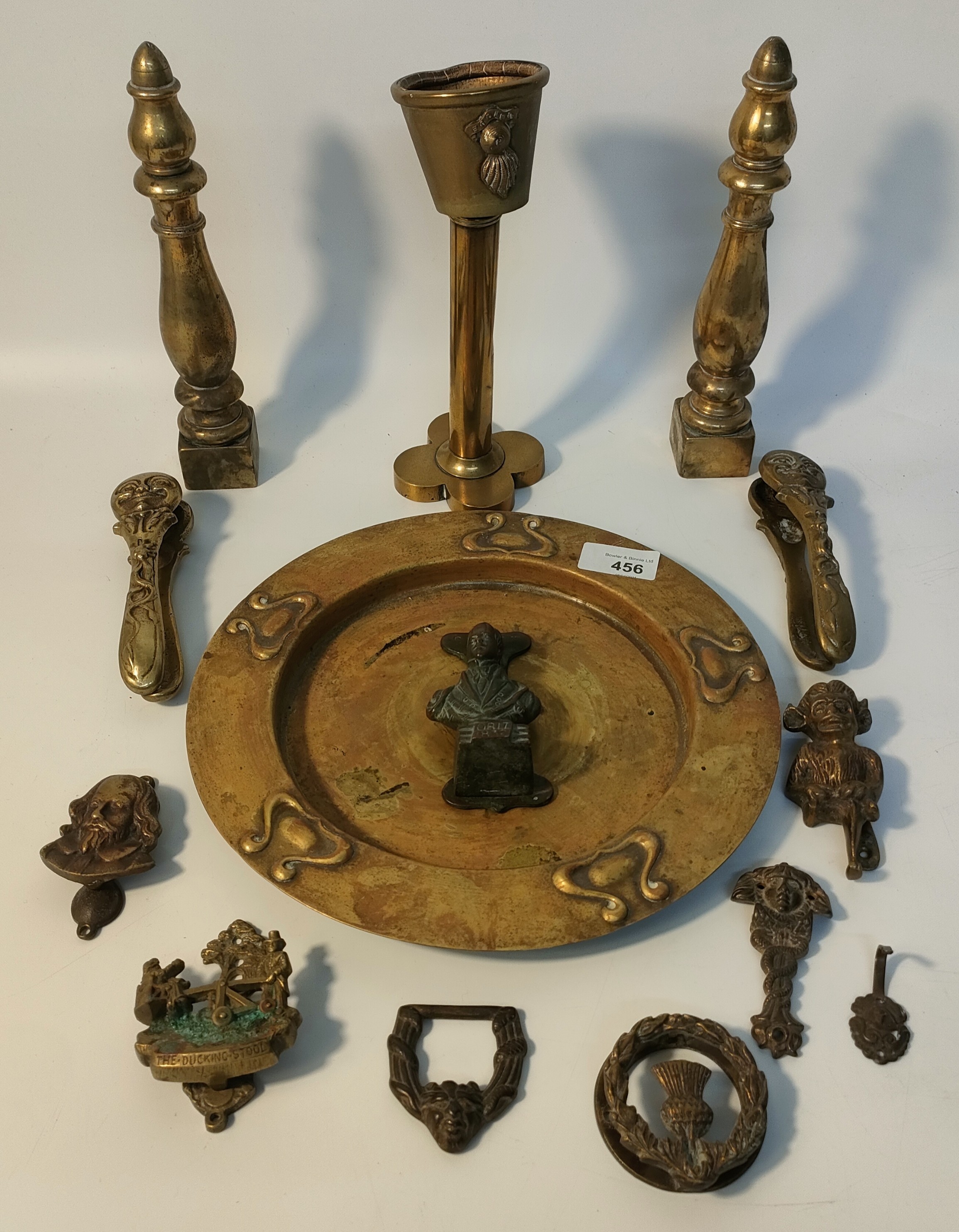 Collection of brass ware; vintage brass door knockers, art nouveau plate & pair of brass moon