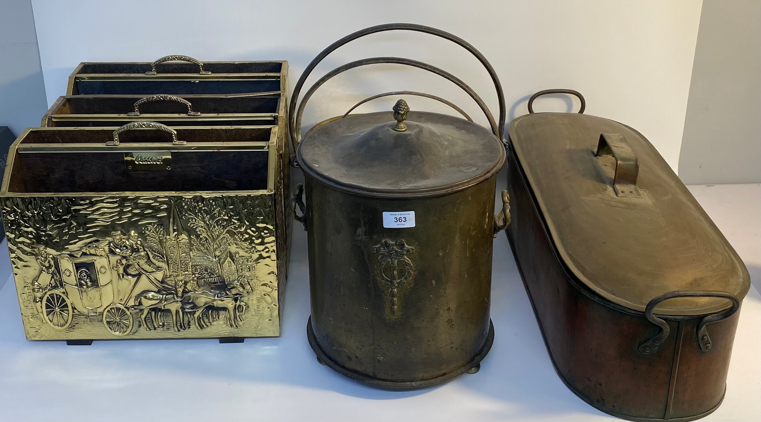 A large collection of brass and copper ware; three brass magazine racks, jelly pans, brass coal