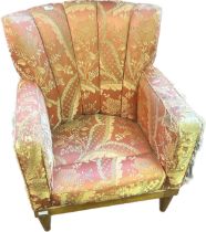 Antique chair, the shell shaped back, above cushioned arms and seat raised on short turned tapered