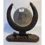 20th century Indian carved dinner gong [30cm]