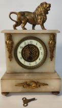 French onyx Style clock with figural lion to top with key & pendulum