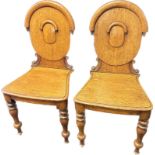 Pair of oak hall chairs