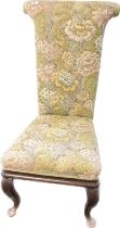 19th century prie dieu chair, covered in a floral upholstery, raised on carved cabriole legs