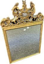 Antique gilt painted mirror, surmounted by scroll and foliate moulding with mirror detail [125x81cm]
