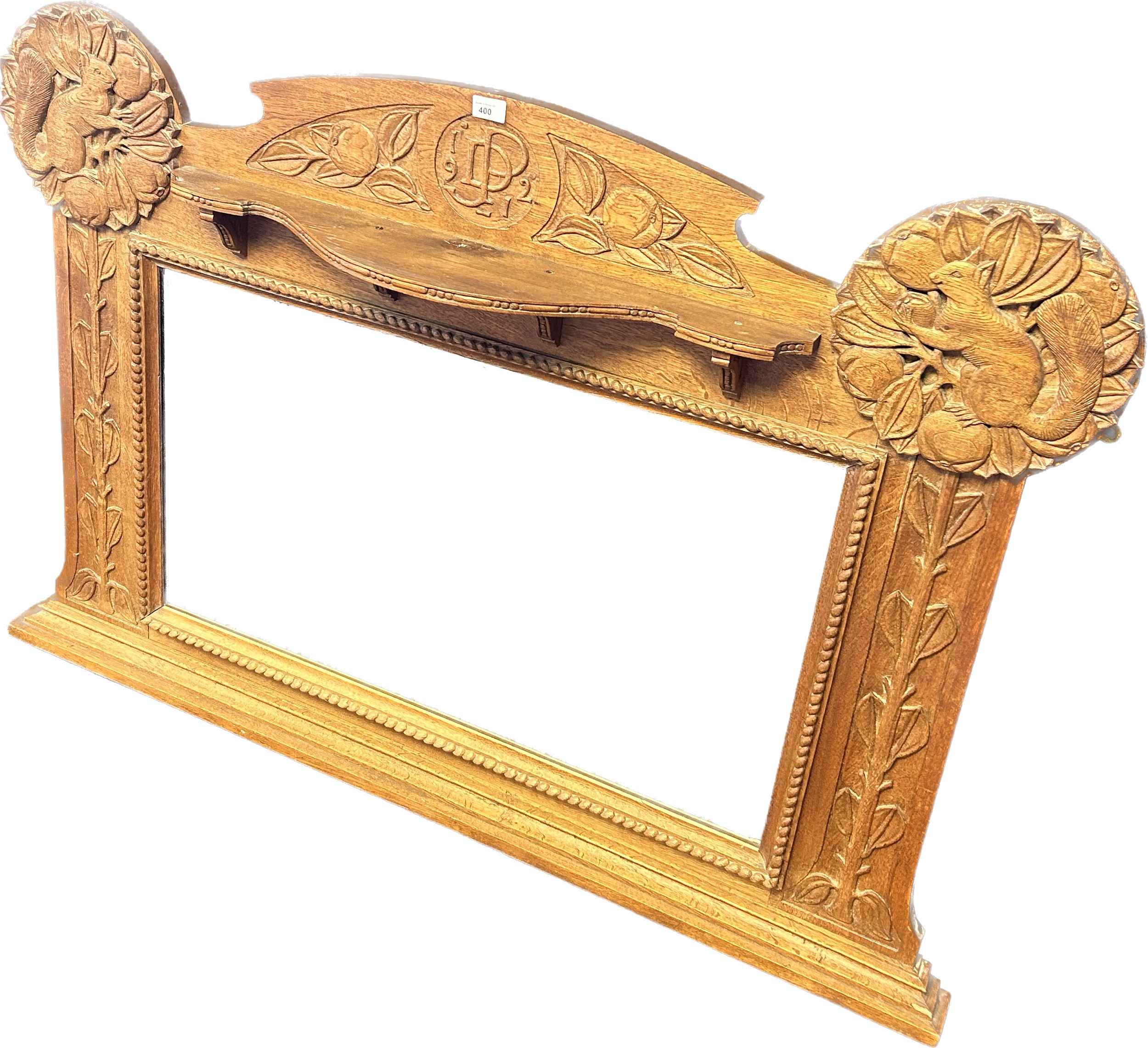 Large oak Art Deco over mantle mirror, carved with squirrels to each side and initials JPD 1912 to
