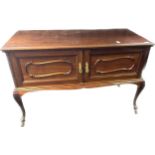 Antique mahogany cabinet, the shaped rectangular top, above two cupboard doors detailed with