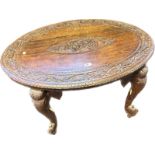 Anglo Indian rosewood table with the oval surface with carved foliate design, the centre with