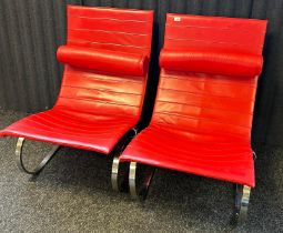 Two retro style red and chrome relaxer chairs