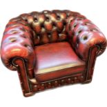 Chesterfield single tub armchair, covered in a red leather button upholstery
