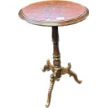 Edwardian stand , the oval top carved with foliate design raised on a tripod base