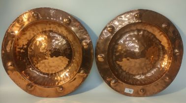 A pair of Scottish arts n crafts style copper wall chargers [39cm]