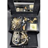 Cantilever box of costume jewellery; necklaces bracelet & earrings