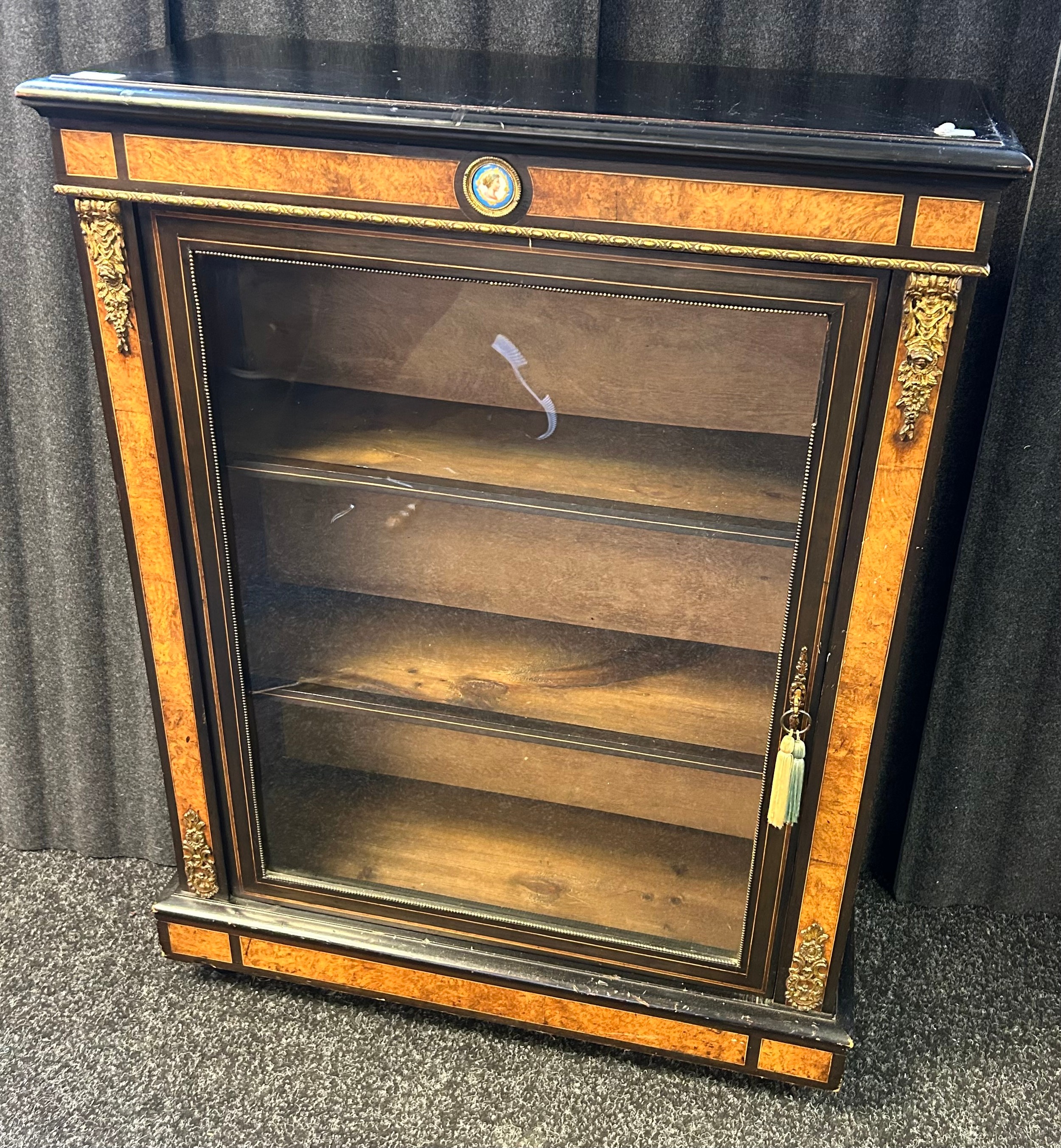 Reproduction blackened display unit with walnut veneer, the glazed door opening to shelved interior, - Image 2 of 2