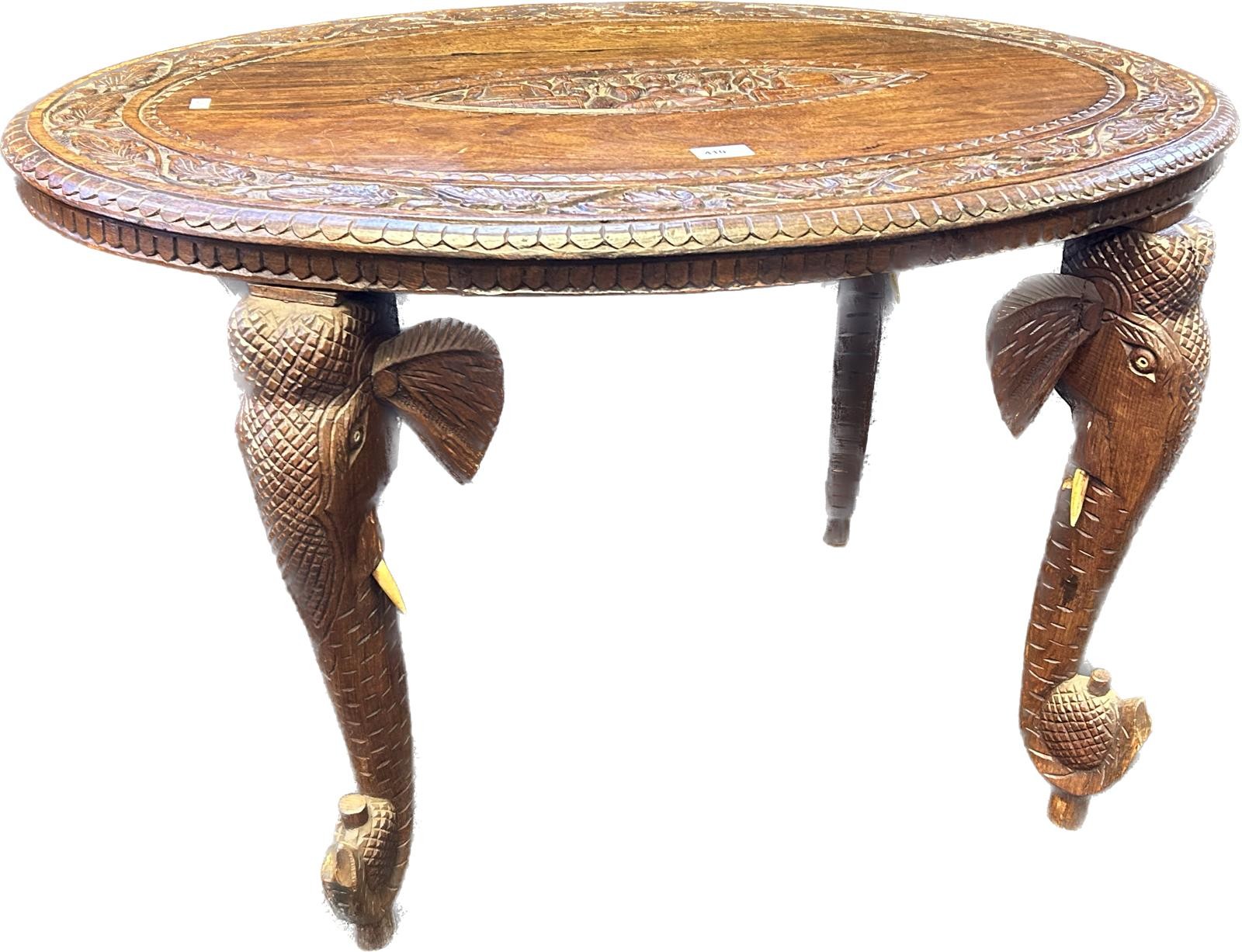 Anglo Indian rosewood table with the oval surface with carved foliate design, the centre with - Image 2 of 3