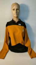 Star Trek the Next Generation Deluxe Shirt Command Uniform with original badge displayed on Tasha
