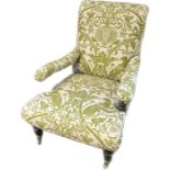 Antique chair, the cushioned back above open arms and a cushioned low seat, the whole covered in a
