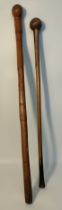 Two 19th century African tribal wooden war clubs [89cm longest]