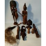 Box of African wooden collectables; African tribal wooden figures & fly swatter