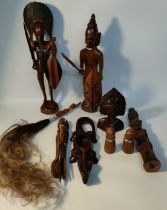Box of African wooden collectables; African tribal wooden figures & fly swatter