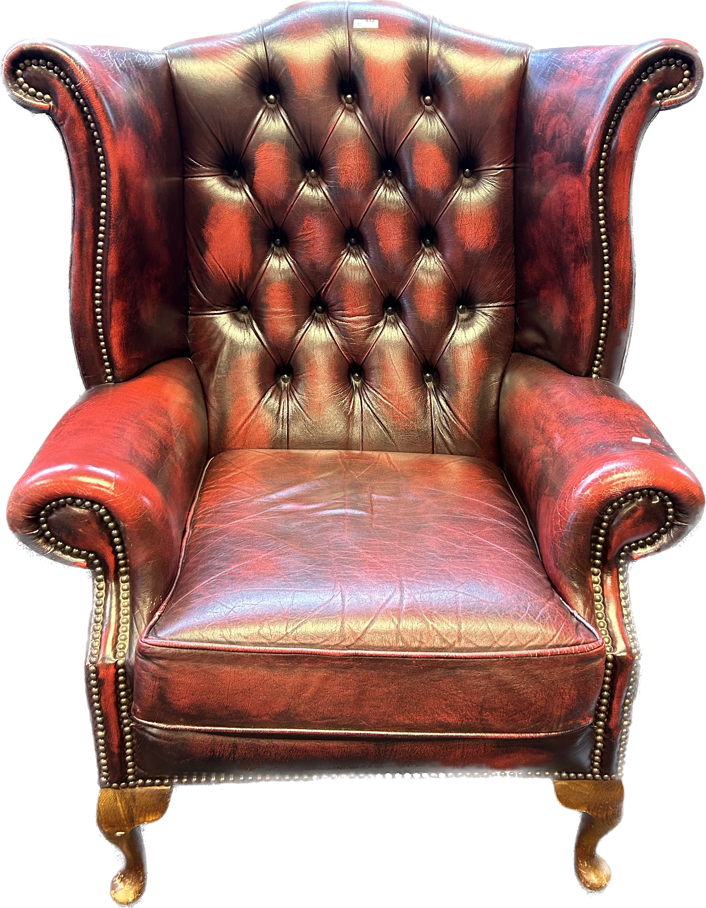 Chesterfield Gullwing chair, covered in a red leather button upholstery