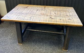 Contemporary Industrial table with rustic wooden top and four fux leather chairs.
