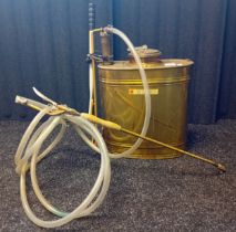 Vintage brass backpack fire extinguisher branded 'Ginge'.