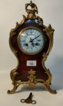 19th century mantel clock in the Louis XV style, with a gilt brass bezel with bevelled convex glass.