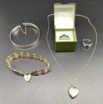 A collection of silver jewellery; silver gate bracelet, silver rings etc