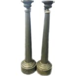 Pair of painted pedestals with graduating columns raised on plinth base