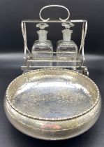 20th century Tantalus with fitted decanter along with silver plated hammered pedestal bowl