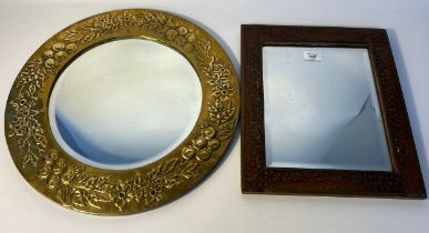 Arts and crafts brass framed mirror depicting flowers together with eastern brass inlaid mirror