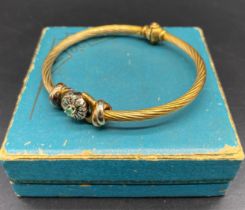 9ct gold twist bangle set with diamond & emerald centre stone [14.36 grams] [5cm diameter]