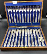 Silver plated fish knives & fork set in fitted display box along with a silver plated nut cracker