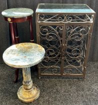 Metal and glass wine holder together with marble top tables.