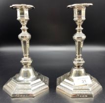 Pair of silver hallmarked [Birmingham] weighted candlesticks with fitted inserts [19cm] [718.54