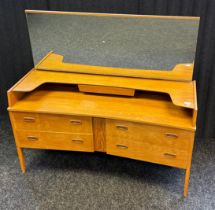 Mid Century dressing table, the back with rectangular mirror, above an open shelf and banks of two