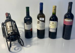5 bottles of various Red Wines together with a wrought iron wine bottle holder