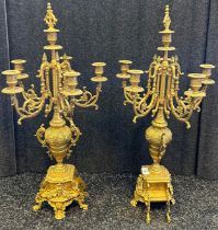 Pair of gilt bronze five branch candleabra, with central urn design column and foliate and scroll