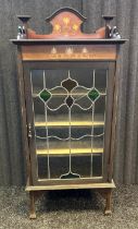 Edwardian display cabinet, the gallery top above a stained glass door opening to shelved interior,