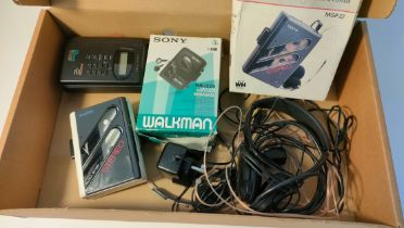 Selection of portable players; Sony Walkman & Sanyo with vintage headphones